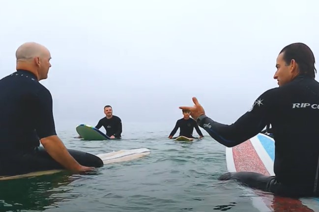 men on boards in the ocean at L7